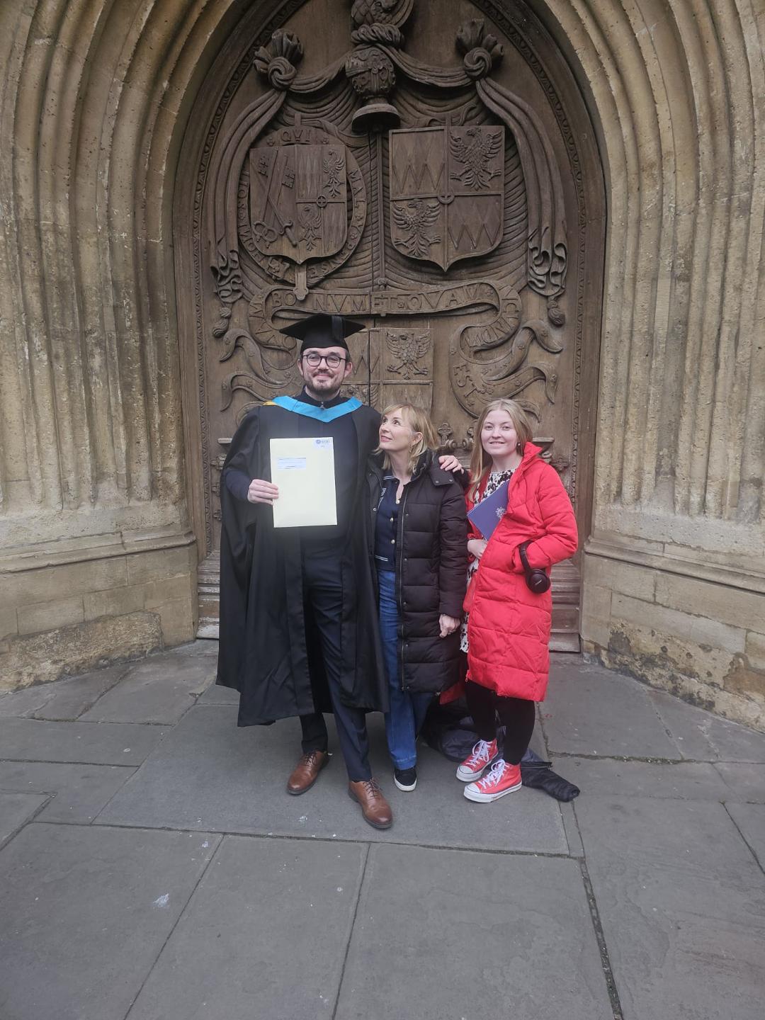 Connor, pictured with his family, at his Master's graduation