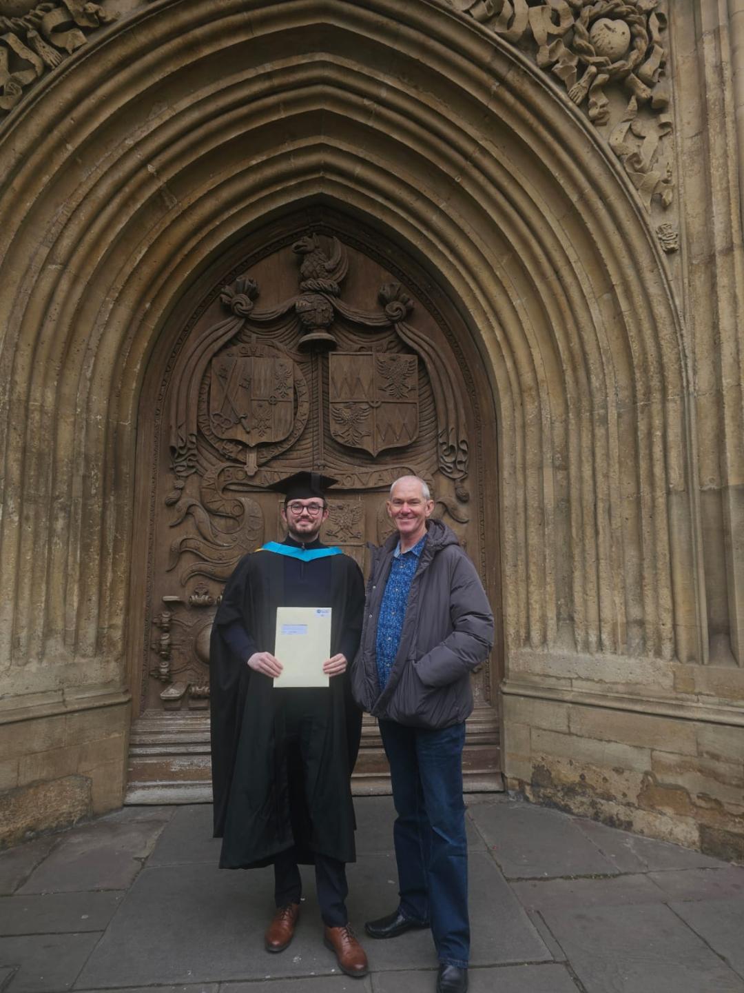 Connor, pictured with his family, at his Master's graduation